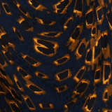 A close-up of a leopard print fabric featuring a dark navy blue base with golden-brown and black irregular spots.